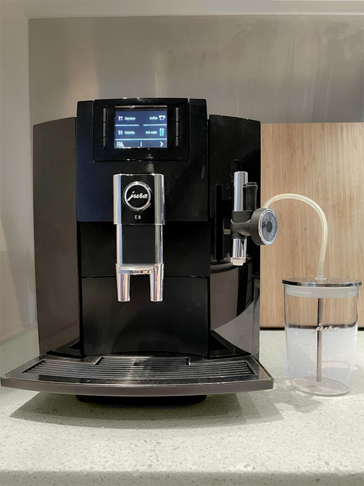Jura E8 piano black coffee machine with jura milk container