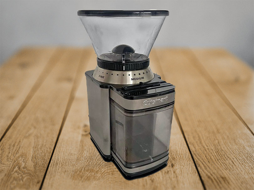 Side view of the Cuisinart DBM-8 sitting on a wooden table
