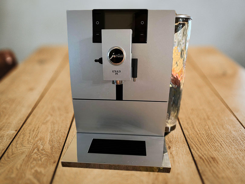 Front view of the Jura ENA 8 on a wooden table