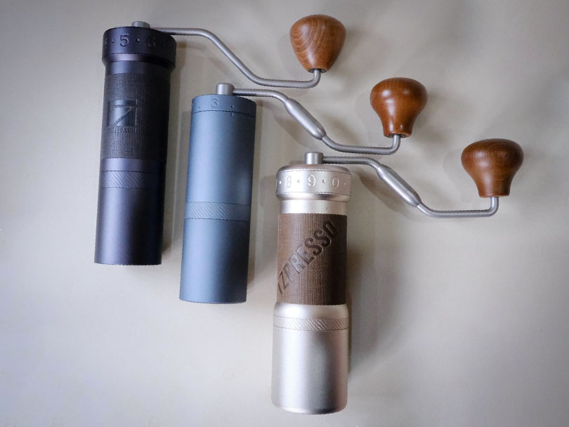 Three 1Zpresso grinders on a white countertop - the ZP6 Special, X Ultra, and K Ultra