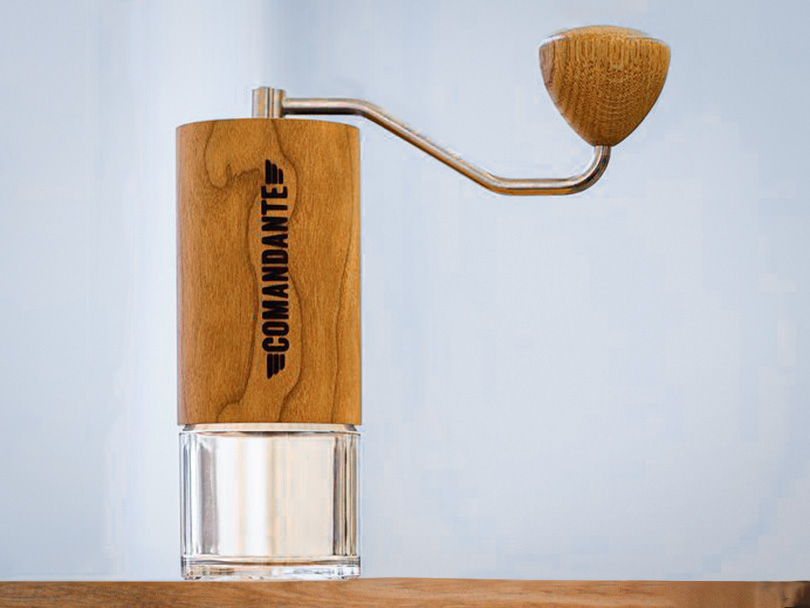 Comandante C40 manual grinder sitting on table, facing camera