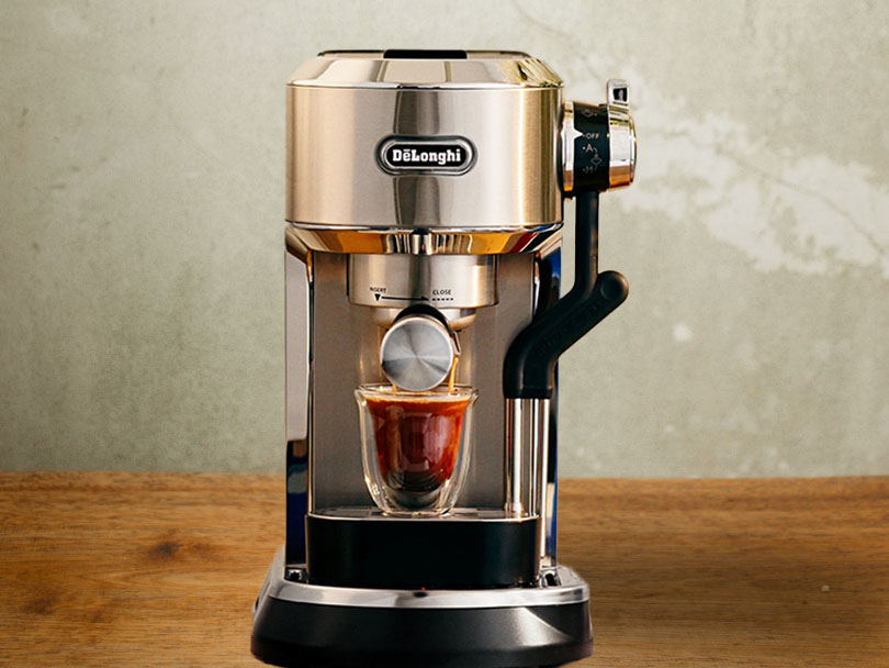 DeLonghi Dedica Maestro Plus with a freshly made shot of espresso on the drip tray