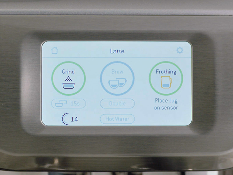Close up of the Breville Barista Touch touchscreen asking user to 'place jug on sensor' to begin automatic milk frothing
