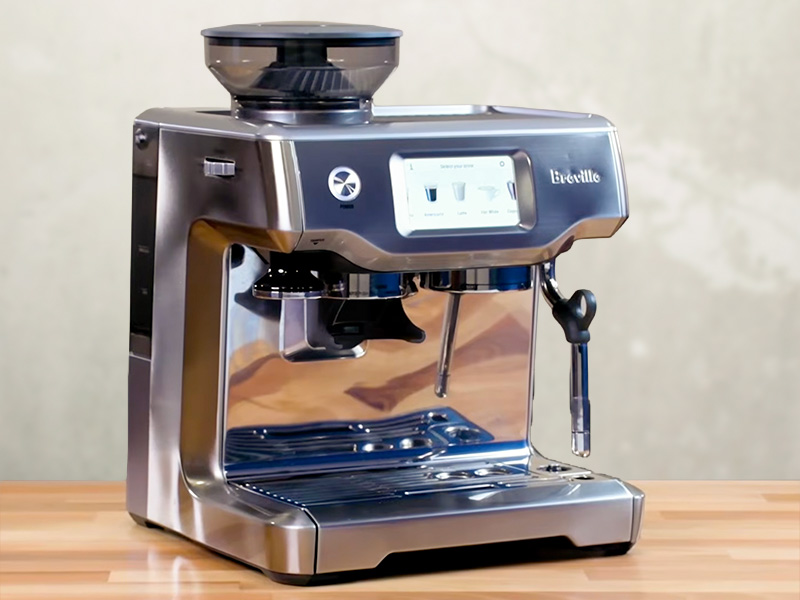 Side view of the Breville Barista Touch, with screen turned on